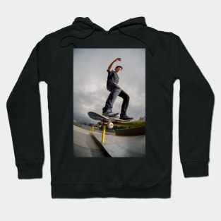 Skateboarder doing a board slide Hoodie